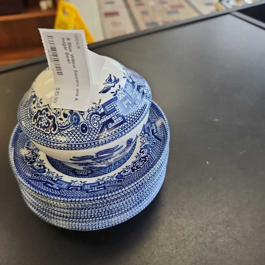 9 Blue Willow Saucers and A sugar Bowl